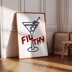 there is a sign that says filthy next to a chair and a table with a drink on it