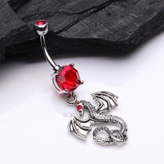 a dragon belly ring with red crystal stones