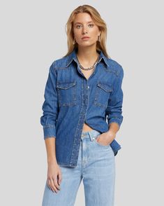 Your classic denim shirt gets a studded, western update. In a bright blue wash, this easy denim shirt features studs along the seams. Pair it with the matching denim bottoms for an easy one-and-done festival look. Casual Denim Top For Rodeo, Dark Wash Western Relaxed Fit Tops, Western Style Dark Wash Relaxed Fit Tops, Dark Wash Relaxed Fit Western Tops, Denim Blue Western Button-up Tops, Western Style Denim Blue Button-up Tops, Light Wash Denim Tops For Rodeo, Classic Denim Tops For Rodeo, Dark Wash Relaxed Fit Top For Rodeo