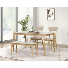 a dining room table with four chairs and a bench