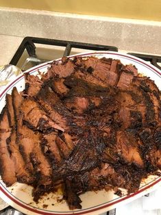 there is a large plate of meat on the stove top, ready to be eaten