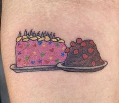 a piece of cake on the left side of the arm is shown with pink frosting and sprinkles