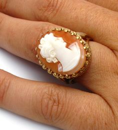 "10k Yellow Gold Cameo Ring Size 6.5 Cameo measures approx. 3/4\" X 1/2\" or 2 cm X 1.6 cm Cameo has a crazing in the stone (small hairline result of aging and dehydration) - this price is reduced Ring cameo rise (from finger, when worn) approx. 1 cm high or 3/8\" Total Weight of the ring: 6.6 Grams 041315-4047 FEEL FREE TO MESSAGE ME WITH A BEST OFFER OR IF YOU WISH TO SEE MORE PICTURES! We combine shipping where you pay only $1.00 more for any additional items on the same order! * Back to Shop White Cameo Rings For Wedding, White Cameo Wedding Rings, Antique White Cameo Rings, White Intaglio Ring For Wedding, White Heirloom Rings With Intaglio, White Cameo Collectible Rings, Collectible White Cameo Rings, Heirloom White Intaglio Rings, Formal White Cameo Rings