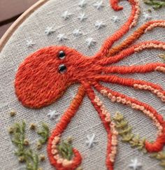 an orange octopus is on the embroidery