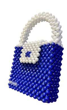 Handmade Royal Blue and White Beaded Bag Acrylic beads, magnetic closure Height: 6 inches/15.24 cm Length side to side: 6.5 inches/16.5 cm Width: 2 inches/5 cm Blue Beaded Party Bag, Blue Beaded Shoulder Bag As Gift, Blue Beaded Shoulder Bag For Gift, Blue Beaded Shoulder Bag As Fashion Accessory, Blue Beaded Shoulder Bag Gift, Blue Rectangular Bag With Pearl Handle, Blue Beaded Bag, Blue Beaded Evening Bag, Luxury Blue Bags With Rhinestones