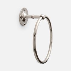 an image of a towel ring on a white wall with the handle extended to it's side