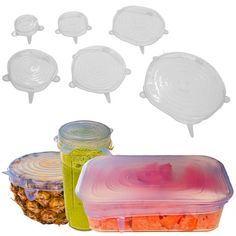 plastic food containers with lids and dividers are shown next to pineapples, carrots, and other foodstuffs