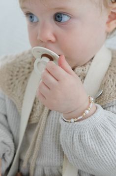 The Eleanor Bracelet is a stylish accessory that’s perfect for any occasion. Crafted with elegant freshwater pearls and gold-filled beads, the bracelet was designed with Maddison Berna. The unique and classy design make a beautiful mommy and me matching bracelet, allowing parents to keep their own piece while also enjoying the same style with their sweet daughter. This bracelet stacks well with our Sweetheart Bracelet. Made to last with 14k gold filled hardware. Comes in baby though adult sizes. Elegant Everyday Cream Bracelets, Classic White Pearl Bracelet With Gold Beads, Classic Pearl Bracelet With Gold Beads For Gift, Classic Pearl Bracelet With Gold Beads As Gift, Classic White Beaded Bracelets With Gold Beads, Classic Adjustable Cream Bracelets, Adjustable Classic Cream Bracelets, Classic Adjustable Cream Bracelet, Sweetheart Bracelet