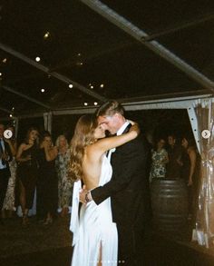 a bride and groom sharing their first dance