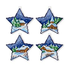 four cross stitch christmas stars with houses and trees in the snow, on a white background