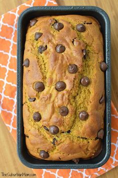 a loaf of chocolate chip pumpkin bread in a pan