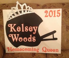 a sign that says kelsey woods, home coming queen with a crown on it