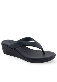 The Aerosoles Isha sandal is an exquisite piece of footwear, crafted with a sleek thong upper and a cushioned footbed inset atop a molded, lightweight unit wedge. Its refined silhouette and superior durability make this sandal perfect for special occasions and everyday wear alike. Experience the luxury of Isha today.FAUX LEATHER UpperSynthetic LiningTPR OutsoleDIAMOND FLEX OUTSOLE Footbed2" Heel heightSandal available in sizes 5-10M with half size,11M,12M | Women's Isha Sandal by Aerosoles in Bl Modern Wedge Sandals With Arch Support For Beach, Summer Toe Loop Sandals With Ortholite Insole, Modern Slip-on Flip Flops With Removable Insole, Summer Toe Post Slippers With Ortholite Insole, Wedge Sandals With Toe Post And Arch Support, Cushioned T-strap Synthetic Sandals, Adjustable Toe Post Wedge Sandals With Arch Support, Synthetic Toe Post Wedge Sandals With Arch Support, Adjustable Synthetic Slippers With Arch Support