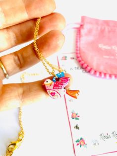 Beautiful little illustrated bird necklace Necklace Basics * Pretty little dainty bird necklace charm. * Laser cut with hard resin to give a glass affect, finished with pretty gems. * Original illustration by Rosie Parker... bring the illustration of this beautiful lady to life. * Dainty gold filled chain. * 18 inch cm drop drop length, fits perfectly on your chest. Why buy me? * I'm very lightweight - you hardly know I'm there! * Beautiful gift idea. * I'm a show stopper statement earrings. * I Bohemian Heart Pendant Charm Necklace Gift, Whimsical Necklaces For Gifts, Delicate Handmade Charm Necklace For Gift, Handmade Cute Jewelry As Gift For Mom, Cute Handmade Jewelry As Gift For Mom, Tiny Pendant Necklace For Gifts, Tiny Pendant Necklace Gift, Handmade Cute Charm Necklaces For Mother's Day, Tiny Pendant Necklace For Gift