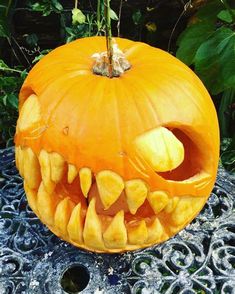 a carved pumpkin with teeth on it