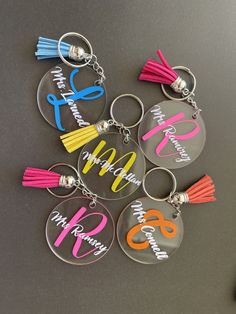 six personalized acrylic key chains with tassels