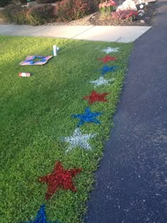 some red white and blue stars painted on the grass