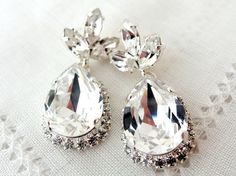 Clear white Chandelier earrings Bridal by EldorTinaJewelry on Etsy, $78.00 #bridal earrings #wedding jewelry #bridesmiads gift #accessories #fashion jewelry #women's fashion Jeweled Dangle Earrings For Wedding, Wedding Dangle Earrings With Jewels, Elegant Crystal Jeweled Earrings For Wedding, Elegant Jeweled Wedding Earrings, Elegant Wedding Crystal Earrings, Elegant Bling Crystal Earrings For Wedding, Elegant Wedding Crystal Earrings With Bling, Silver Crystal Bridal Earrings For Bridesmaid, Wedding Drop Crystal Earrings With Rhinestones