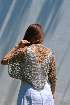 Sweet and simple little Brownish taupe/Beige shrug for summer days when all you need is a light weight cover-up to throw over your shoulders. I hand knit this item with a cotton viscose ethically sourced yarn. It is very soft and comfortable. The open-net/loose-knit style will keep you cool but still giving you the coverage you desire. Color: Soft Brownish Taupe/Beige-earthy tones (shown in cover photo) Oatmeal Brown Mix (not shown) Ivory Yellow Green and taupe mix Aqua Turquoise and Lime Brown Open Knit Shrug For Summer Beach, Open Knit Summer Shrug For Beach, Summer Beach Open Knit Shrug, Beach Open Knit Shrug, Crochet Shawl For Summer Beach, Summer Beach Crochet Shawl, Beige Open Knit Beach Cover-up, Summer Bolero, Shrug Knitting Pattern