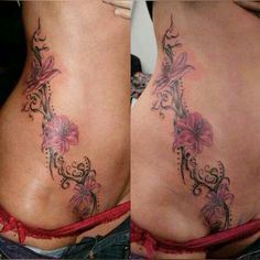 a woman's lower back tattoo with flowers on it