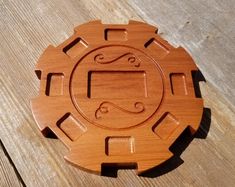 a wooden object sitting on top of a wooden table