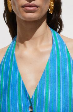 Perfect your next ensemble with this open-back halter vest made from a lightweight linen blend covered in vibrant stripes. Front button closure; ties at back Halter neck Front besom pockets Lined 55% linen, 45% viscose Dry clean or machine wash, line dry Imported