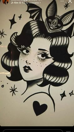 a woman's face painted on the side of a wall with stars and bats