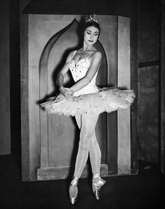 a black and white photo of a ballerina