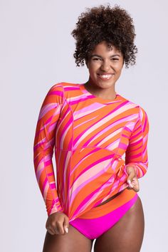 For those looking for full coverage from the Sun, the Hera long-sleeved long-lined rashguard is your go-to top. This top is meant to be used on land and sea with its quick-drying and soft-to-the-touch Surf-Tec Fabric. Flattering and form-fitting, the Freya pairs beautifully over any bikini top. This long-sleeve rash guard is a perfect addition to your swimwear collection. Keeping you going all day long, this swimsuit is carefully designed with our ultra-soft Surf-Tec fabric keeping you going all day long. Made for women with curves, designed with coverage, support, and compression in mind to keep you on the move. Features: Good for: Surfing, paddling, beach, lifestyle Curvy Surfer Girl Collection by JOLYN Long-Sleeved Cropped Rashguard Full Coverage (5) High Impact (5) Tagless for maximum Cropped Rash Guard, Swimsuits Athletic, Athletic Swimwear, Land And Sea, Beach Stores, Swim Caps, Beach Lifestyle, Womens Bathing Suits, Surfer Girl