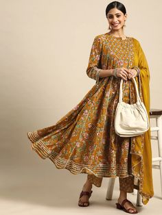 This is a beautiful 3-piece set. The set comes with floral print & gota patti detailing angrakha kurta has round neck, calf length and 3/4th sleeves teamed with printed trouser pants and a chiffon dupatta. Total No of Set-3 Kurta Fabric: Cotton Bottom Fabric - Cotton Dupatta Fabric-Chiffon Work Done - Gota Patti & Print Detailing. Sleeve Length: 3/4th Sleeves Color: Yellow Occasion: Party Wear Washing Instructions: Hand Wash or Dry Clean Angrakha Suit, Cotton Dupatta, Chiffon Dupatta, Cotton Bottoms, Suit Set, Trouser Pants, Online Retail, Indian Wear, Fabric Cotton