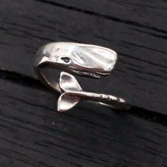 This sperm whale ring is just the thing for anyone who admires these great behemoths of the deep. He is cast in solid 925 sterling silver, then oxidized and hand burnished to bring out all the details including those on the inside of the ring (see the third picture). The ring is available from a size 5.5 up to a 8.5. ALTERNATIVE FINISH: https://www.etsy.com/listing/232499822/moby-dick-whale-ring-in-solid-bronze https://www.etsy.com/ca/listing/163829524/silver-moby-dick-whale-ring-in-solid?ga_sea Sperm Whale, Silver Jewelry Design, Funky Jewelry, Rare Gemstones, Wrap Rings, Dream Jewelry, Pretty Jewellery, The Thing, Ring Sterling Silver