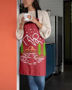 a woman wearing an apron holding a cup