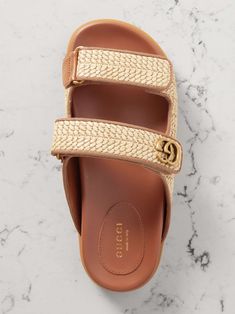 GUCCI Moritz grosgrain-trimmed raffia sandals Gucci Sandals With Woven Sole For Summer, Chic Straw Sandals With Cork-bed Midsoles, Chic Sandals With Cork-bed Midsoles, Luxury Slides With Textured Footbed For Spring, Luxury Beige Slides For Spring, Designer Leather Sandals With Textured Footbed, Luxury Slip-on Slides For Summer, Luxury Summer Footbed Sandals With Leather Sole, Gucci Luxury Sandals With Leather Sole