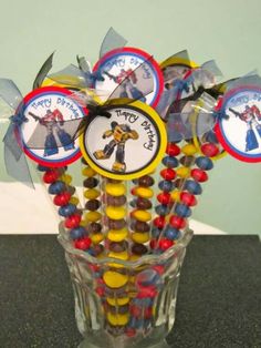 a glass vase filled with candy covered candies