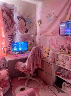 a bedroom with pink walls and lots of stuffed animals on the floor, including a computer desk