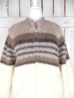 "Vintage Tundra ivory/brown striped thick virgin wool knit chunky cardigan sweater/snow/ski cabin sweater jacket/Scandinavian yarn Measurements... taken flat -marked size: medium -chest: 22\"  -length: 26\"  -sleeve: 29\" ...from neckline Features... -thick cozy 100% pure virgin wool/Scandinavian yarn  -awesome texture and feel -great neutral colors -zipper closure -side pockets/stretch cuffs -fully lined  -Tundra Fleece -made in Canada  Condition... -great vintage condition -small faint minor d Nordic Style White Outerwear For Fall, Cozy Striped Winter Outerwear, Striped Knitted Winter Outerwear, Cream Fair Isle Pattern Outerwear For Fall, Cream Fair Isle Outerwear For Fall, Brown Hand Knitted Winter Outerwear, Winter Striped Wool Outerwear, Vintage Striped Winter Outerwear, Cozy Brown Outerwear With Fair Isle Pattern