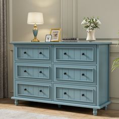 Coming and see this exquisite dresser, a perfect blend of style and practicality for your bedroom haven. Crafted with precision from high-quality materials, this dresser boasts 6 spacious drawers adorned with Classical Black knobs and 6 round solid wood legs for stability. Its elegant seamlessly integrates into any interior design scheme, from classic to contemporary, exuding timeless charm. Sitting atop sturdy legs, the dresser ensures stability while maintaining an air of refined grace. Each d Light Blue Dresser, Furniture Color Ideas, Bedding Red, Dresser Brown, Black Knobs, Blue Dresser, Drawer Glides, Massage Room, Modern Dresser