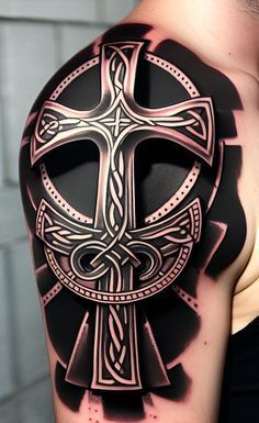 a man with a tattoo on his arm and shoulder has a cross in the center