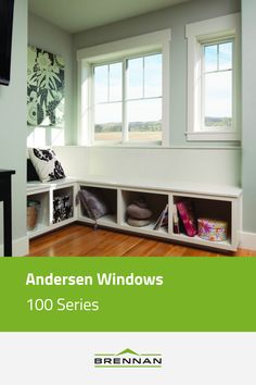 the interior of a house with windows and wooden flooring, including bookshelves