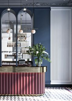 the bar is decorated in blue and pink tones