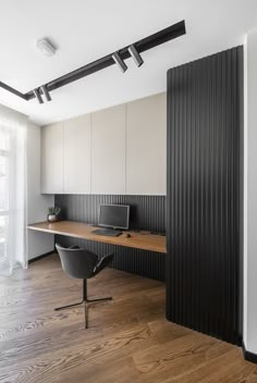 an empty office with black and white walls