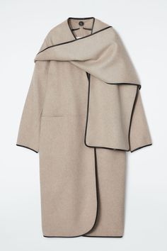 This season, the womenswear team add subtle polished touches to the classic wool coat. Double-faced for a premium finish, this one is designed with a detachable scarf that cocoons the neck and clean, rounded edges bound with butter-soft leather. Pockets are discreetly placed on the waistline and press studs hold the wrap-over fold in place. Relaxed fitPress-stud closureThis product contains Responsible Wool Standard TE-00047206 (RWS) wool fiber from farms certified to animal welfare and land-man Scarf Coat, Best Winter Coats, Scarf Jacket, Elegant Scarves, Coat Trends, Land Management, Denim T Shirt, Coats Jackets Women, Animal Welfare