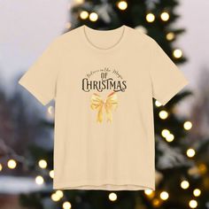 🧑‍🎄 Harness the magic of Christmas with this festive christmas tee! This classic unisex jersey short-sleeve tee is designed to fit like a well-loved favorite, featuring a soft cotton feel and a quality print that will make you fall in love with it over and over again. Fabric Blends: Ash and Heather Prism colors: 99% Airlume combed and ring-spun cotton, 1% polyester. Heather and Solid Blend colors: 52% cotton, 48% polyester. Athletic Heather and Black Heather: 90% cotton, 10% polyester. Adorn y Pink Christmas T-shirt With Short Sleeves, Christmas Tees, Christmas Bows, Prism Color, Festive Christmas, Christmas Magic, Jersey Shorts, Short Sleeve Tee, Print Quality