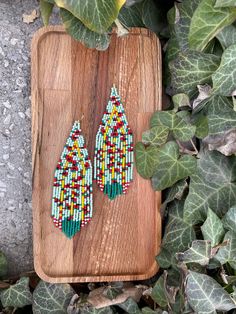 Poppy flower beaded earrings, powder green floral Fringe Seed bead earring Summer Bright flowers earring Beadwork dangle earring Long Boho ♥𝑇ℎ𝑒 𝑝𝑎𝑡𝑡𝑒𝑟𝑛 𝑜𝑓 𝑡ℎ𝑖𝑠 𝑒𝑎𝑟𝑟𝑖𝑛𝑔 𝑖𝑠 𝑐𝑟𝑒𝑎𝑡𝑒𝑑 𝑏𝑦 𝐾𝑎𝑍𝑒𝐵𝑒𝑎𝑑𝐽𝑒𝑤𝑒𝑙𝑟𝑦 ♥𝑀𝑎𝑑𝑒 𝑢𝑠𝑖𝑛𝑔 𝑓𝑟𝑒𝑒ℎ𝑎𝑛𝑑 𝑏𝑒𝑎𝑑𝑖𝑛𝑔 𝑤𝑜𝑣𝑒𝑛 𝑡𝑒𝑐ℎ𝑛𝑖𝑞𝑢𝑒𝑠 𝑤𝑖𝑡ℎ 𝑠𝑡𝑟𝑜𝑛𝑔 𝑠𝑦𝑛𝑡ℎ𝑒𝑡𝑖𝑐 𝑡ℎ𝑟𝑒𝑎𝑑. ♥𝑇ℎ𝑒 𝑠𝑖𝑧𝑒 𝑜𝑓 𝑡ℎ𝑒 𝑠𝑒𝑒𝑑 𝑏𝑒𝑎𝑑𝑠 𝑢𝑠𝑒𝑑 𝑖𝑠 2 𝑚𝑖𝑙𝑙𝑖𝑚𝑒𝑡𝑒𝑟𝑠 𝑎𝑛𝑑 𝑏𝑒𝑎𝑑𝑠 𝑎𝑟𝑒 ℎ𝑖𝑔ℎ 𝑞𝑢𝑎𝑙𝑖𝑓𝑖𝑒𝑑. ♥𝐴𝑙𝑙 𝑡ℎ𝑒 ℎ𝑜𝑜𝑘𝑠 𝑢𝑠𝑒𝑑 𝑖𝑛 𝑜𝑢𝑟 𝑗𝑒𝑤𝑒𝑙𝑟𝑦 𝑎𝑟𝑒 24 𝑘 𝑔𝑜𝑙𝑑 𝑝𝑙𝑎𝑡𝑒𝑑 𝑎𝑛𝑑 ℎ𝑦𝑝𝑜𝑎𝑙𝑙𝑒𝑟𝑔𝑒𝑛𝑖𝑐. ♥𝑇ℎ𝑒𝑠𝑒 𝑎𝑟𝑒 𝑣𝑒𝑟𝑦 𝑙𝑖𝑔ℎ𝑡 𝑒𝑎𝑟𝑟𝑖𝑛𝑔𝑠 𝑡ℎ𝑎𝑡 𝑦𝑜𝑢 𝑐𝑎𝑛 𝑤𝑒𝑎𝑟 𝑎𝑙𝑙 𝑑𝑎𝑦 𝑤𝑖𝑡ℎ𝑜𝑢𝑡 ℎ𝑢𝑟𝑡𝑖𝑛𝑔 𝑦𝑜𝑢𝑟 𝑒𝑎𝑟! The onl Green Teardrop Earrings With Tiny Beads, Green Teardrop Beaded Earrings With Tiny Beads, Unique Green Dangle Flower Earrings, Handmade Green Flower Drop Earrings, Green Drop Earrings With Colorful Beads, Unique Green Teardrop Beaded Earrings, Handmade Green Dangle Flower Earrings, Green Dangle Earrings With Tiny Beads, Bohemian Flower Shaped Colorful Beaded Earrings