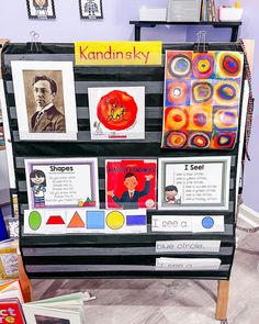 an art display with posters and pictures on the front, along with other items for children's arts and crafts