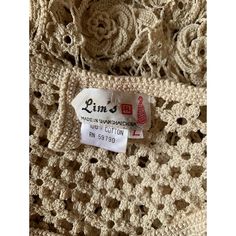 a crocheted dress with a label on it that says, lin's