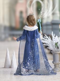 Adorn your little one in the splendor of the Royal Velvet Frost Gown, a regal attire that exudes the quiet elegance of a serene winter kingdom. The luxurious blue velvet dress is kissed with glitter filigree across the bodice, skirt, and sleeves, sparkling with the mystique of a moonlit snowfield. A plush fur collar, dotted with twinkling red rhinestones, sits at the neckline, adding a touch of opulent warmth. The majestic, extra-long train is a celebration of winter's beauty, draped with metall Elsa Costume, Blue Velvet Dress, Princess Elsa, Ice Princess, Ice Queen, Elsa Frozen, Christmas Fashion, Inspired Dress, Blue Velvet