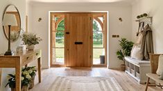 an entryway with wooden doors and white walls