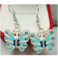 Blue Butterfly Earrings With Rhinestones On Their Wings. 2.1" Dangle, Handmade, With Sterling Silver Plated Hooks And Hand Painted Using An Oil Based Paint. New / Never Worn. Nwot. Blue Metal Earrings With Rhinestones, Blue Dangle Earrings Made Of Alloy, Blue Dangle Jewelry Made Of Alloy, Blue Alloy Dangle Jewelry, Blue Dangle Jewelry In Alloy, Blue Alloy Earrings For Gift, Silver Rhinestone Alloy Earrings, Blue Metal Crystal Earrings, Blue Crystal Metal Earrings For Pierced Ears