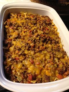 a casserole dish filled with meat and cheese